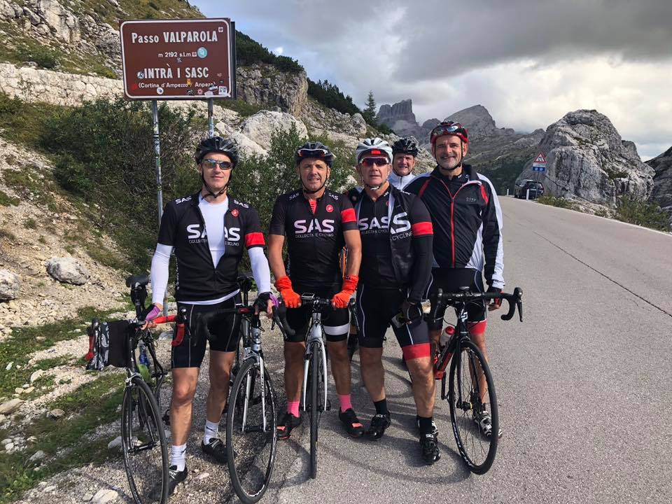 Cyclists at the summit of the Passo Valparola in the Italian Dolomites
